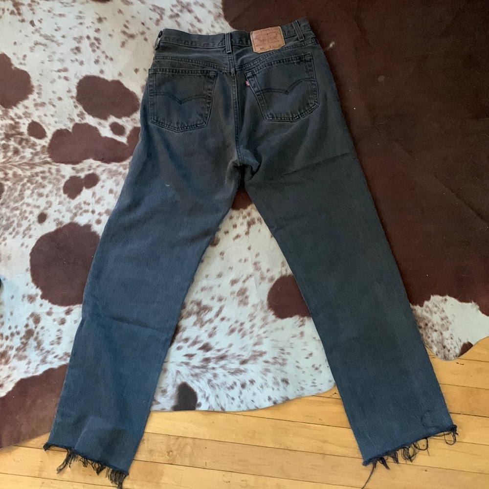sick faded black vintage levi 501s with raw edge